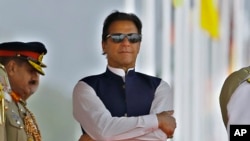 Pakistan's Prime Minister Imran Khan attend