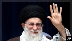 Iran's Supreme Leader Ayatollah Ali Khamenei waves to his supporters before starting his speech in the province of Kermanshah, west of Tehran October 15, 2011. Khamenei said on Saturday U.S. accusations that two Iranians planned to assassinate the Saudi A